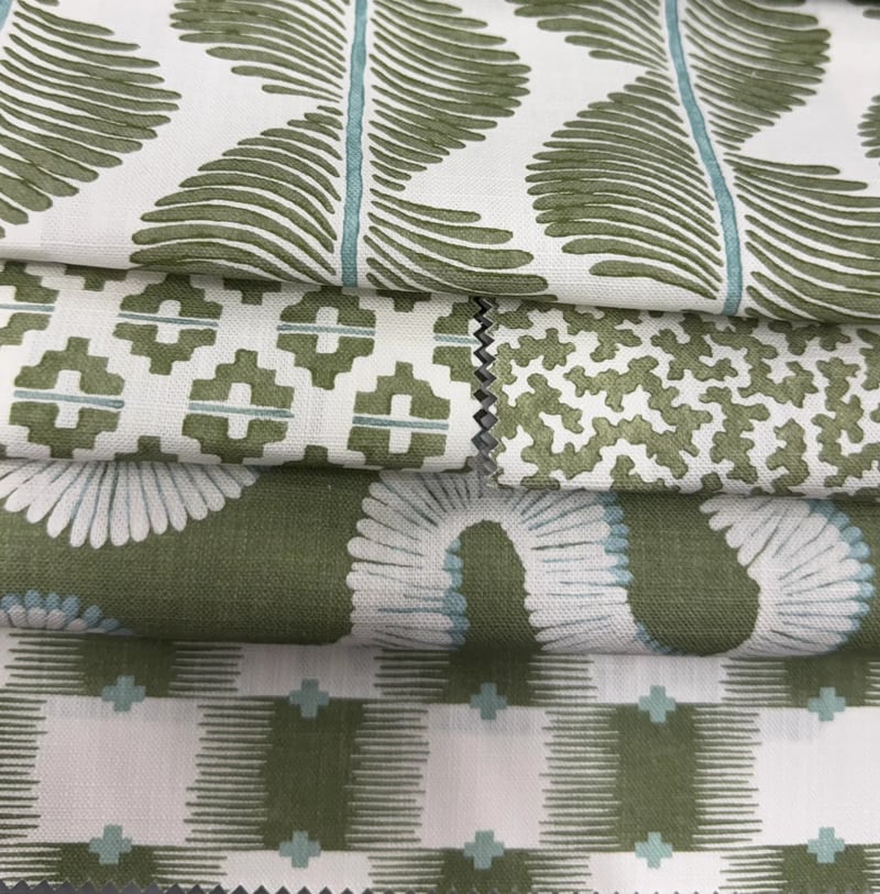Folded green and white printed fabric samples
